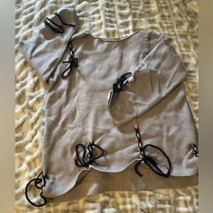 Oversized grey ripped sweater with ties